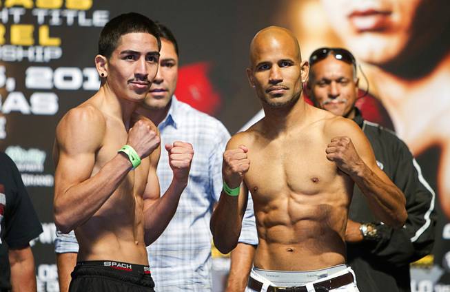 IBF bantamweight champion Leo Santa Cruz (L)  of Mexico poses with Eric Morel of Puerto Rico during an official weigh-in at the MGM Grand Garden Arena in Las Vegas, Nevada September 14, 2012. Cruz will defend his title against Morel at the arena September 15.