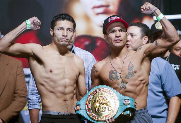 Mexican boxers Jhonny Gonzalez (L), WBC featherweight champion, and Daniel Ponce De Leon pose during an official weigh-in at the MGM Grand Garden Arena in Las Vegas, Nevada September 14, 2012. Gonzalez will defend his title against Ponce De Leon at the arena September 15.
