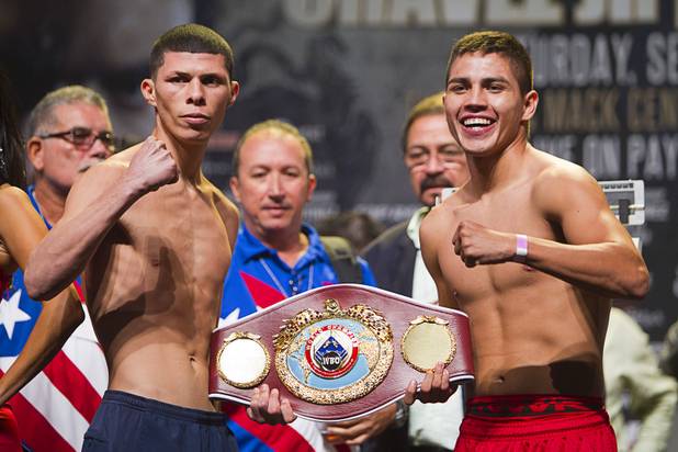 Super featherweight boxers Rocky Martinez (L) of Puerto Rico and Miguel Beltran Jr. of Mexico pose during an official weigh-in at the Wynn Las Vegas Resort in Las Vegas, Nevada Sept. 14, 2012. Martinez and Beltran will fight for a vacant WBO super featherweight title at the Thomas & Mack Center in Las Vegas September 15.