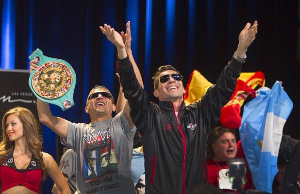 Boxer Sergio Martinez (R) of Argentina reacts to the cheers of fans as he arrives for an official weigh-in at the Wynn Las Vegas Resort in Las Vegas, Nevada Sept. 14, 2012. Martinez will challenge WBC middleweight champion Julio Cesar Chavez Jr., son of boxing legend Julio Cesar Chavez, at the Thomas & Mack Center in Las Vegas September 15.