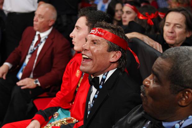 Retired boxer Julio Cesar Chavez urges on his son Julio Cesar Chavez Jr. as he fights against Sergio Martinez during their title fight at the Thomas & Mack Center in Las Vegas, Nevada Sept. 15, 2012.
