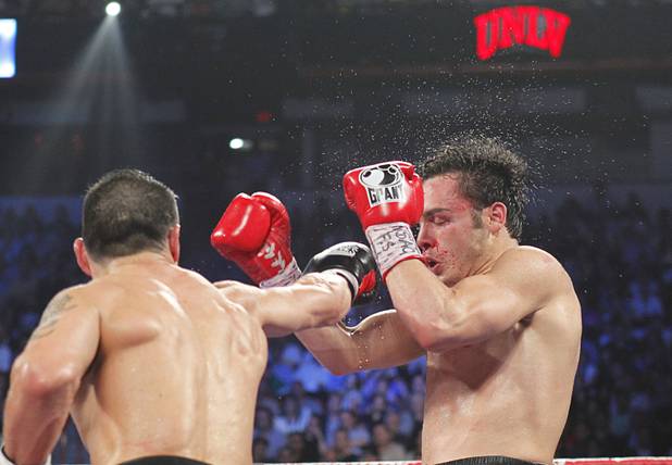 Sergio Martinez (L) of Argentina connects on WBC middleweight champion Julio Cesar Chavez Jr. of Mexico during their title fight at the Thomas & Mack Center in Las Vegas, Nevada Sept. 15, 2012.