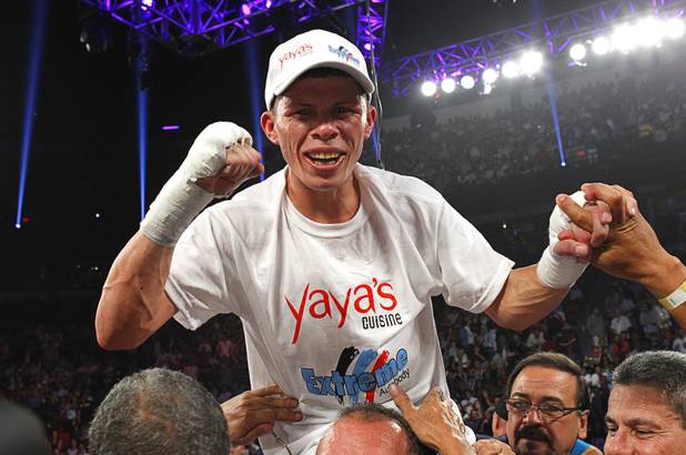 Roman Martinez of Puerto Rico celebrates his victory over Miguel Beltran Jr. of Mexico following their fight for the vacant WBO super featherweight title at the Thomas & Mack Center in Las Vegas, Nevada Sept. 15, 2012.