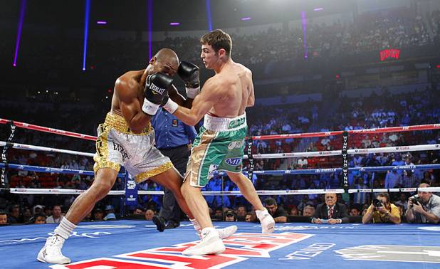 Matthew Macklin (R) of England connects on Joachim Alcine (L) of Canada during a middleweight bout at the Thomas & Mack Center in Las Vegas, Nevada Sept. 15, 2012.