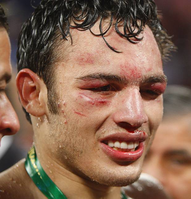 Julio Cesar Chavez Jr. of Mexico stands in the ring after losing to Sergio Martinez of Argentina following their title fight at the Thomas & Mack Center in Las Vegas, Nevada Sept. 15, 2012.
