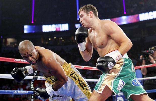 Joachim Alcine (L) of Canada falls to the canvas after getting hit from a punch by Matthew Macklin of England during a middleweight bout at the Thomas & Mack Center in Las Vegas, Nevada Sept. 15, 2012. Macklin won with a first round TKO.