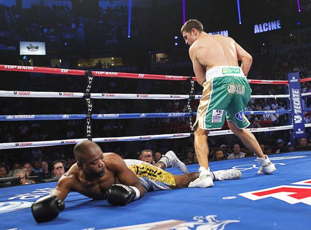 Joachim Alcine (L) of Canada hits the canvas after getting hit from a punch by Matthew Macklin of England during a middleweight bout at the Thomas & Mack Center in Las Vegas, Nevada Sept. 15, 2012. Macklin won with a first round TKO.