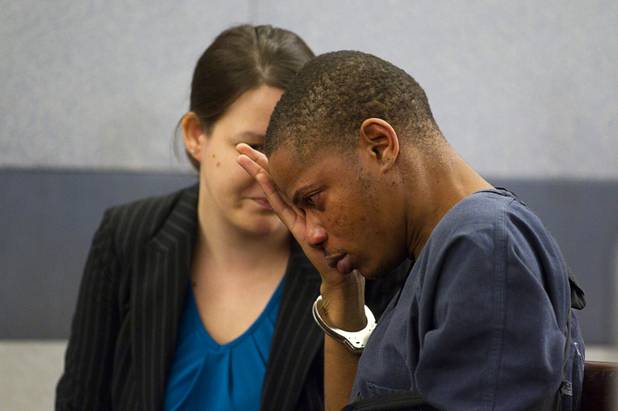 Gary Lee Hosey Jr., the suspected driver of the car that crashed into the bus stop on Spring Mountain Road Thursday, wipes his eyes as he talks with attorney Caitlyn McAmis at the Regional Justice Center Monday, Sept. 17, 2012. Four people died and eight were injured in the accident.