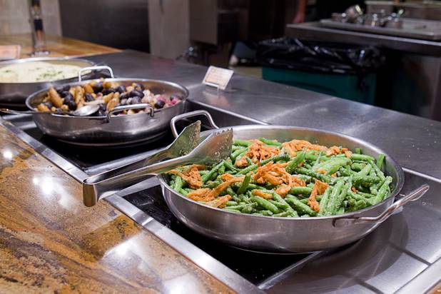 Sauteed green beans with garlic and crispy onions are displayed at the Wicked Spoon buffet in the Cosmopolitan Tuesday, Sept. 18, 2012.