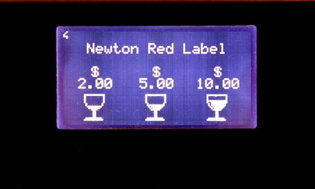 A self-service wine kiosk display gives prices for a Newton Red Label wine at the Wicked Spoon buffet in the Cosmopolitan Tuesday, Sept. 18, 2012. Diners use a prepaid card that gives access to a variety of wines.