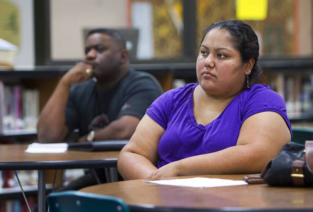 Beatriz Rubio listens during a Clark County School District informational meeting at the Bonanza High School library Tuesday, Sept. 18, 2012. CCSD officials answered questions related to a property tax initiative that will be on the ballot in November.  The six-year capital levy, if approved, will raise $669 million for high-need school maintenance and renovations. 