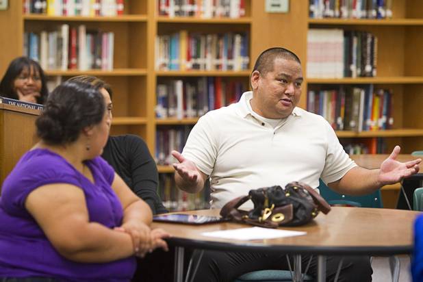 Ross Yamashita asks a question during a Clark County School District informational meeting at the Bonanza High School library Tuesday, Sept. 18, 2012. CCSD officials answered questions related to a property tax initiative that will be on the ballot in November.  The six-year capital levy, if approved, will raise $669 million for high-need school maintenance and renovations. 