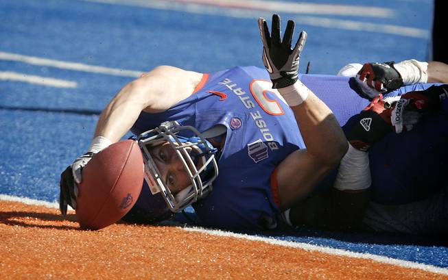 Boise State's Matt Miller stretches for a touchdown against Miami of Ohio during the first half of the Broncos' victory on Saturday, Sept. 15, 2012, in Boise, Idaho.