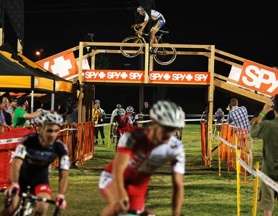 Racers in the elite men category ride over and under a flyover bridge during the CrossVegas cyclocross race Wednesday, Sept. 19, 2012 at Desert Breeze Park.
