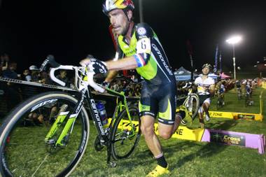 Timothy Johnson runs over an obstacle during the CrossVegas cyclocross race Wednesday, Sept. 19, 2012 at Desert Breeze Park.