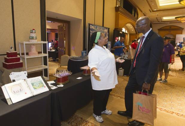 Sonya Washington, owner of Castle of Cakes, talks with Audrey ...