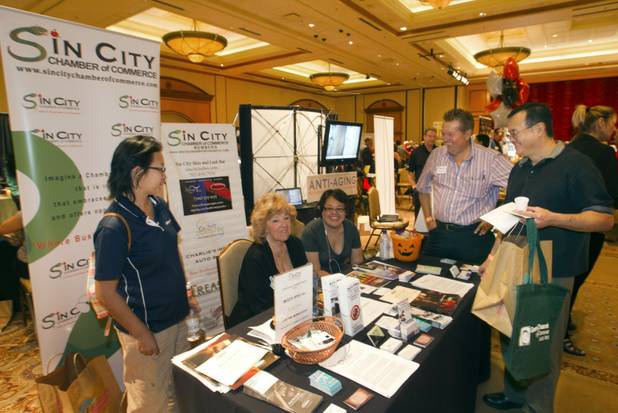 Century 21 agent George Shimoyama, right, talks with members of ...