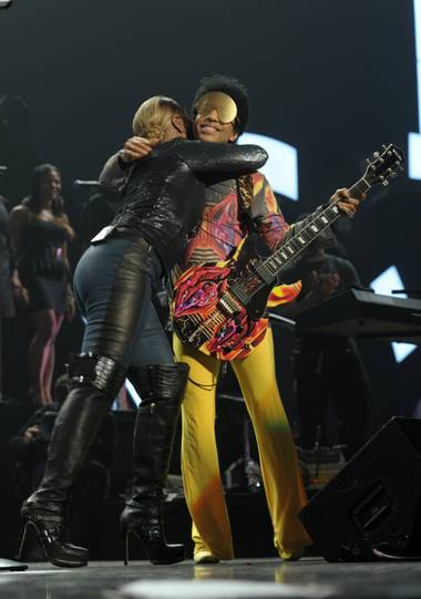 Mary J. Blige and Prince embrace during Night 2 of the 2012 iHeartRadio Music Festival at MGM Grand Garden Arena on Saturday, Sept. 22, 2012.