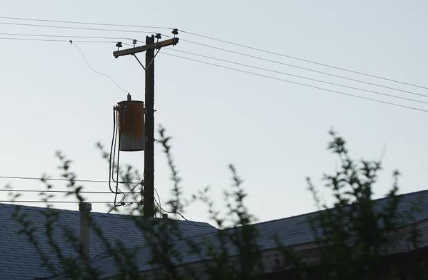 A fire that apparently spread from an electrical transformer on a utility pole damaged six homes in a neighborhood near Washington Avenue and Pecos Road Sunday, Sept. 23, 2012. Firefighters from the City of Las Vegas Fire Department, Clark County Fire Department, North Las Vegas Fire Department responded to fight the fires. Four people suffered injuries. One cat was killed.