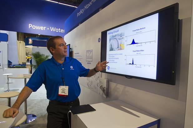 Derrick Moolman, mining and cloud solutions leader for GE Mining, gives a presentation on GE software during the MINExpo International 2012 trade show at the Las Vegas Convention Center Monday, Sept. 24, 2012. The software includes remote monitoring to optimize the production process and diagnostic software that can anticipate equipment failure, he said.
