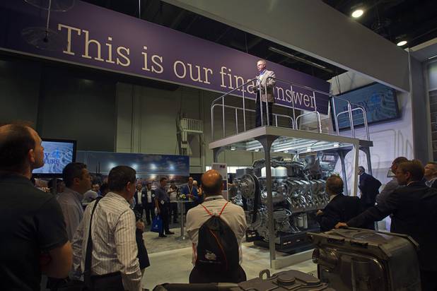 Scott Woodruff, director of global mining sales for MTU, gives a presentation over a mining engine during the MINExpo International 2012 trade show at the Las Vegas Convention Center Monday, Sept. 24, 2012.