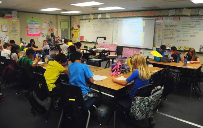 Wright Elementary School fourth-graders works on a writing assignment on Wednesday, Sept. 26, 2012. 