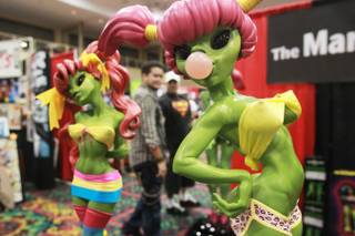Hyper-sexualized alien sculptures by Mark Alfrey are seen on display at the Las Vegas Comic Expo Saturday, Sept. 29, 2012.