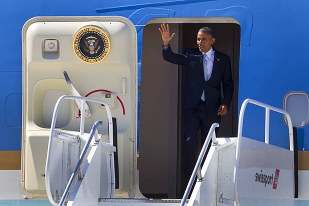 President Barack Obama waves as he arrives at McCarran International Airport Sunday, Sept. 30, 2012. Obama will attend a campaign rally then stay in Henderson as he prepares for his first debate with Republican presidential candidate Mitt Romney. The debate will be held in Colorado Wednesday.