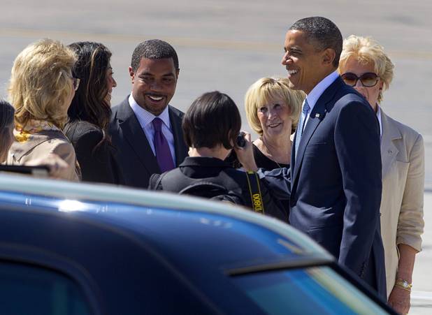 President Barack Obama meets with politicians and other invited guests at McCarran International Airport Sunday, Sept. 30, 2012. Among the guests are Steven Horsford, left, Nevada senate majority leader, Clark County Commission Chairwoman Susan Brager, center, and Las Vegas Mayor Carolyn Goodman. Obama will attend a campaign rally then stay in Henderson as he prepares for his first debate with Republican presidential candidate Mitt Romney. The debate will be held in Colorado Wednesday.