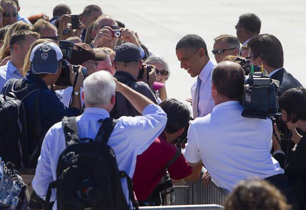 President Barack Obama meets with guests after arriving at McCarran International Airport Sunday, Sept. 30, 2012. Obama will attend a campaign rally then stay in Henderson as he prepares for his first debate with Republican presidential candidate Mitt Romney. The debate will be held in Colorado Wednesday.