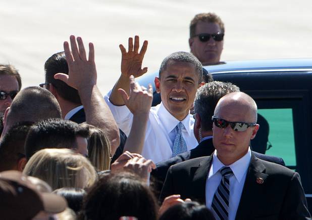 President Barack Obama meets with guests after arriving at McCarran International Airport Sunday, Sept. 30, 2012. Obama will attend a campaign rally then stay in Henderson as he prepares for his first debate with Republican presidential candidate Mitt Romney. The debate will be held in Colorado Wednesday.