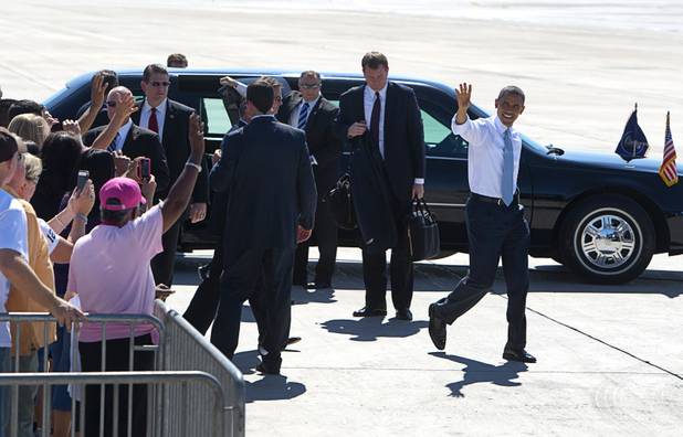 President Barack Obama waves to guests before leaving McCarran International Airport Sunday, Sept. 30, 2012. Obama will attend a campaign rally then stay in Henderson as he prepares for his first debate with Republican presidential candidate Mitt Romney. The debate will be held in Colorado Wednesday.