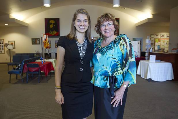 Intern Pastor Kaitlyn Ferguson poses with Pastor Marta Poling-Goldenne before her first morning of preaching at New Song Church in Henderson Sunday, Sept. 30, 2012.
