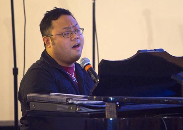 Jason Manlapaz sings a gospel song at New Song Church in Henderson Sunday, Sept. 30, 2012.