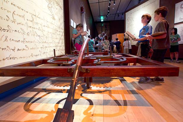 Hyde Park Middle School students Lucas Patyk, left and Tyler Young look over a reproduction of a self-propelled car during a visit to the "Da Vinci- The Genius" exhibit at the Imagine Gallery in the Venetian Monday, Oct. 1, 2012. This week, all Hyde Park sixth graders, who have been studying about  Leonardo Da Vinci for about a month, will visit the exhibit. The traveling exhibit has been extended through January, a representative said.