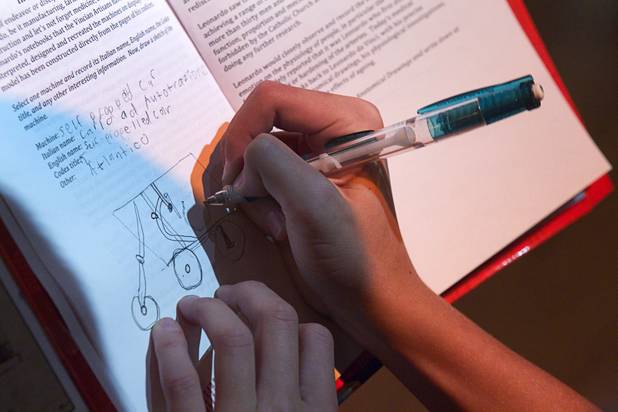 A Hyde Park Middle School student makes a drawing of a self-propelled car during a visit to the "Da Vinci- The Genius" exhibit at the Imagine Gallery in the Venetian Monday, Oct. 1, 2012. This week, all Hyde Park sixth graders, who have been studying about  Leonardo Da Vinci for about a month, will visit the exhibit. The traveling exhibit has been extended through January, a representative said.