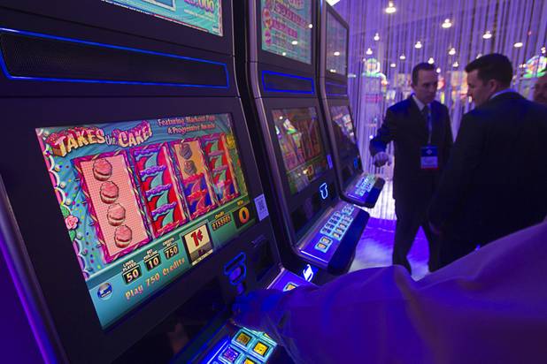 The "Takes the Cake" slot machine by IGT is displayed during the Global Gaming Expo (G2E) at the Sands Expo Center Tuesday, Oct. 2, 2012. The game was developed as a companion game to the popular Candy Bars slot machine.