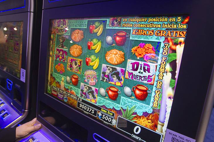A Day of the Dead-themed slot machine by IGT is displayed during the Global Gaming Expo (G2E) at the Sands Expo Center Tuesday, Oct. 2, 2012. The language on the machine changes from English to Spanish at the touch of a button