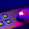 A man operates a joystick for a skill-based bonus game on an IGT slot machine during the Global Gaming Expo (G2E) at the Sands Expo Center on Tuesday, Oct. 2, 2012.