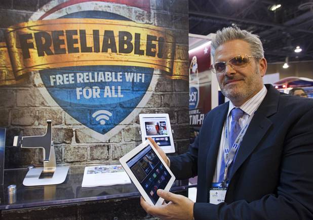 Mick Hall, CEO of R66T Networks, a Las Vegas-based wi-fi content management company, poses at his booth during the Global Gaming Expo (G2E) at the Sands Expo Center Tuesday, Oct. 2, 2012.