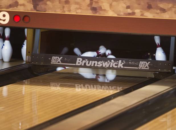 A bowler makes a strike at Red Rock Lanes in the Red Rock Resort Wednesday, Oct. 3 2012. Irma Wenzel, 79, was recognized Wednesday for bowling a perfect game at the bowling center on Sept. 26.