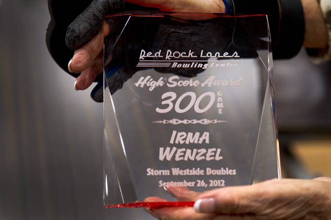 Bowler Irma Wenzel, 79, holds her trophy at Red Rock Lanes in the Red Rock Resort Wednesday, Oct. 3 2012. Wenzel was recognized Wednesday for bowling a perfect game at the bowling center on Sept. 26.