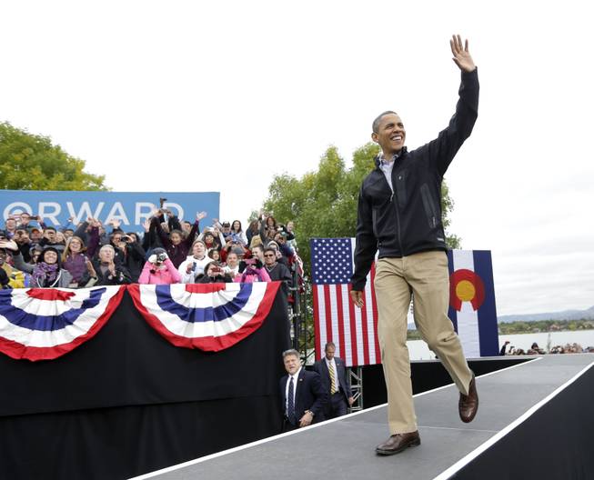 President Barack Obama walks on stage during a campaign event at Sloan's Lake Park, Thursday, Oct. 4, 2012, in Denver.