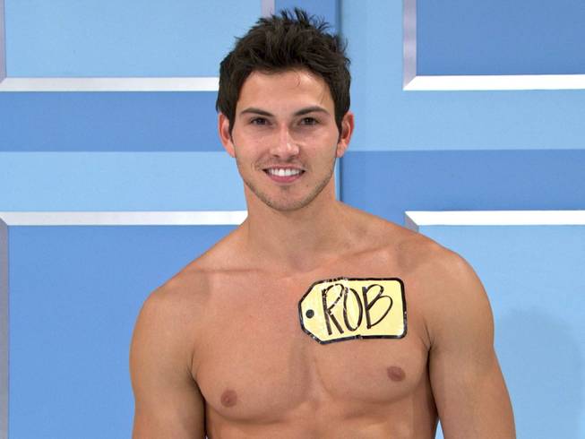 This undated image from video shows Rob Wilson, of Boston, who was chosen in an online competition to be the first male model on "The Price Is Right."  Wilson begins his weeklong stint alongside the ladies on Oct. 15. Hosted by Drew Carey, "The Price Is Right" airs weekdays.