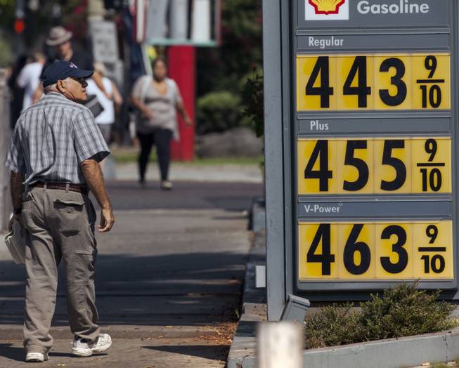 A pedestrian looks at high gasoline prices at a gas station in Los Angeles Thursday, Oct. 4, 2012. Motorists in California paid an average of $4.232 per gallon Wednesday. That’s 45 cents higher than the national average and exceeded only by Hawaii among the 50 states.