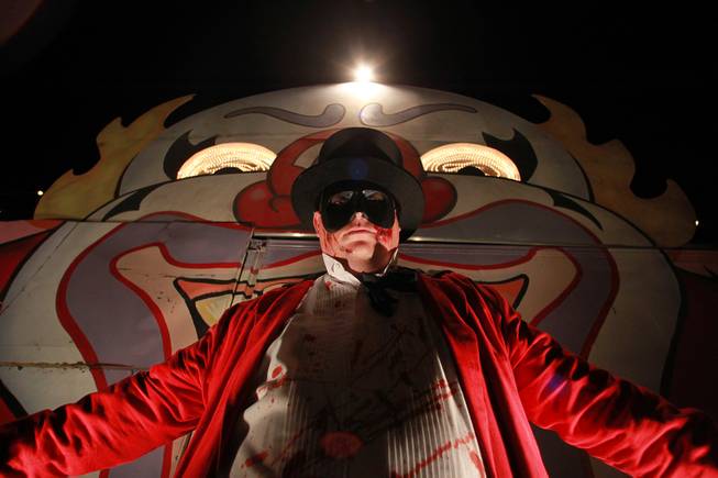 "The Ringmaster" stands at the entrance of one of the Freakling Brothers Trilogy of Terror haunted houses in north west Las Vegas Saturday, Oct. 6, 2012.