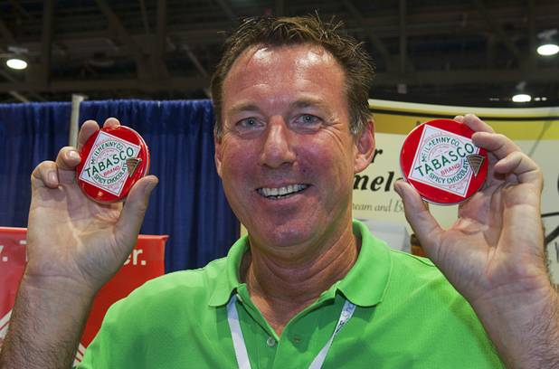 Jeff Thackaberry displays tins of Tabasco chocolate during the annual National Association of Convenience Stores (NACS) trade show at the Las Vegas Convention Center Monday, Oct. 8, 2012.