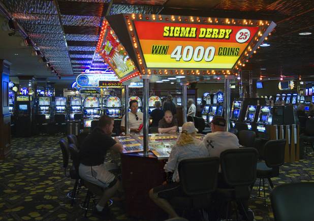 Gamblers try out a Sigma Derby game on a "Vintage Vegas" casino floor at the D Las Vegas in downtown Las Vegas Tuesday, Oct. 9, 2012. The casino had to reapply to have the game approved in Nevada because the original approval had expired, said CEO Derek Stevens. The casino, formerly Fitzgeralds, is celebrating it's rebranding and renovation with festivities this weekend.