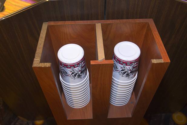Coin buckets are stacked by video poker machines that accept coins on "Vintage Vegas" casino floor at the D Las Vegas in downtown Las Vegas Tuesday, Oct. 9, 2012. The casino, formerly Fitzgeralds, is celebrating it's rebranding and renovation with festivities this weekend.