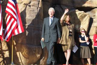 Former President Bill Clinton enters the stage with U.S. Rep. Shelley Berkley, D-Nev. during a rally at the Springs Preserve in Las Vegas on Tuesday, October 9, 2012.